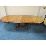 A LARGE 19TH CENTURY MAHOGANY PULL-OUT EXTENDING DINING TABLE, having two additional leaves,