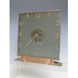 AN ART DECO 8 DAY GLASS MANTLE CLOCK, of square form on a shaped base, H 20.5 cm, W 20 cm