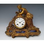 A GILDED BRONZE FEMALE FIGURAL BELL STRIKE MANTLE CLOCK, comprising a neo-classical female draped