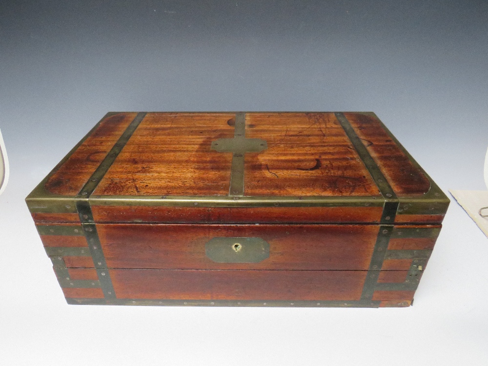 A LARGE 19TH CENTURY MAHOGANY BRASS BOUND CAMPAIGN MILITIA WRITING SLOPE, the hinged lid opening