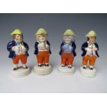 FOUR 19TH CENTURY PEARLWARE FIGURATIVE PEPPER POTS, average H 15 cm