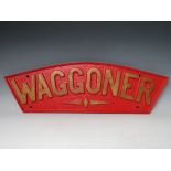 AN ARCHED WOODEN LOCOMOTIVE FOUNDRY CASTING MOULD NAME PLATE 'WAGGONER', painted red and gold, the