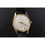GARRARD - A 9CT GOLD WRIST WATCH, on leather strap, Dia 3.5 cmCondition Report:ticks on winding -