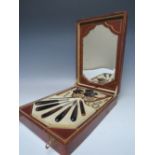 A VINTAGE LEATHER CASED VANITY / DRESSING TABLE MANICURE SET, the hinged lid having attached pull
