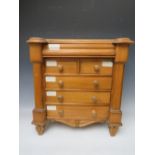 A 20TH CENTURY APPRENTICE CHEST OF DRAWERS IN THE SCOTTISH STYLE, having two short over three