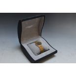 LONGINES - A CLASSIC DATE WRIST WATCH, on gold plated bracelet with spare link and original box, Dia