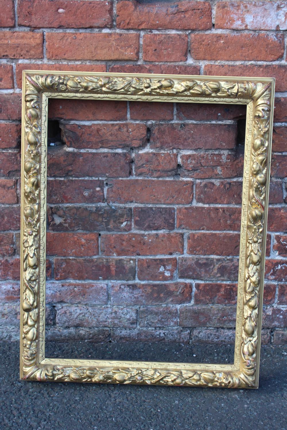A LATE 18TH / EARLY 19TH CENTURY DECORATIVE GOLD FRAME WITH FRUIT DESIGN, frame W 7.5 cm, rebate