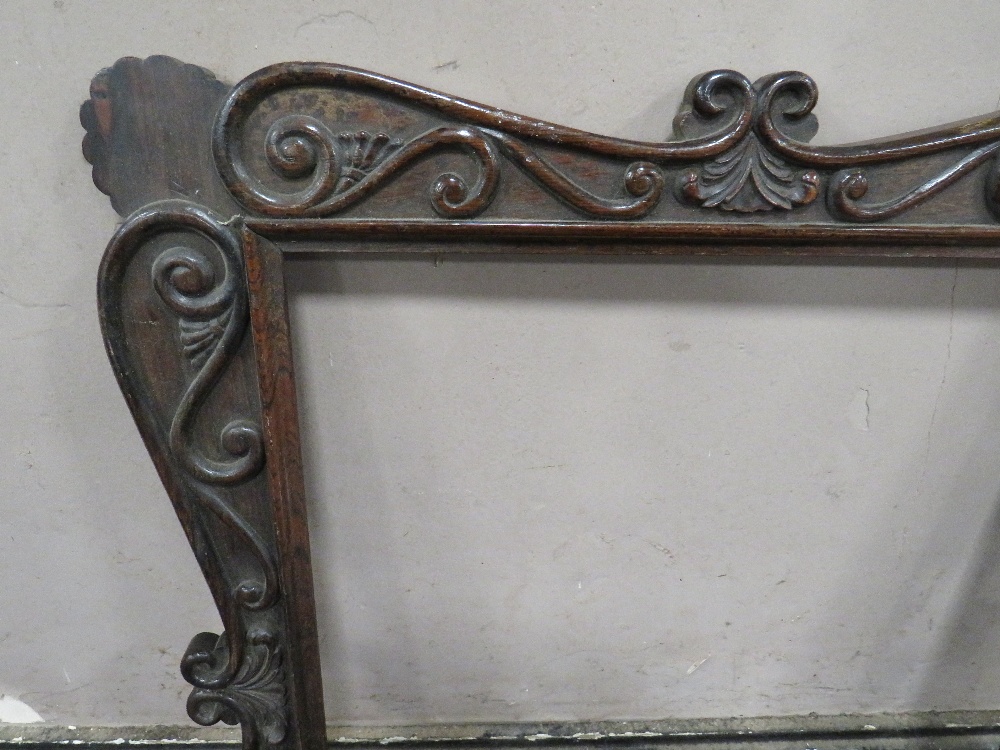 A 19TH CENTURY DECORATIVE DARK HARDWOOD FRAME WITH SCROLLING, widest frame W 7.5 cm, rebate 43 x