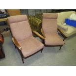 A PAIR OF RETRO TEAK RECLINING ARMCHAIRS