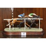 A BORDER FINE ARTS HORSE RACING FIGURE OF TWO HORSES WITH JOCKEYS SURMOUNT - SIGNED ANNE WALL