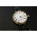 AN ANTIQUE MANUAL WIND WRISTWATCH - PROBABLY IN A GOLD CASE