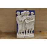 A CERAMIC RELIEF CAST WALL HANGING PLAQUE OF A ROMANESQUE CHOIR - STAMPED TO THE REVERSE