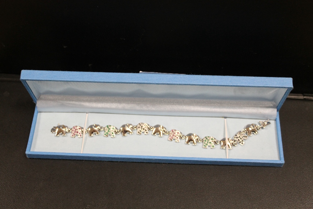 A .925 SILVER GEMSET ELEPHANT TRAIN BRACELET