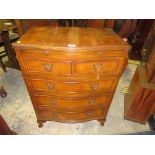 A SMALL REPRODUCTION WALNUT SERPENTINE FIVE DRAWER CHEST WITH BRUSHING SLIDE H-82 W-62 D-42 CM