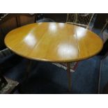 AN ERCOL BLONDE DROPLEAF TABLE A/F *STAINED*