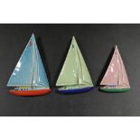 THREE GRADUATING WADE SAILBOATS