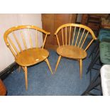 A PAIR OF BLONDE ERCOL STICKBACK ARMCHAIRS