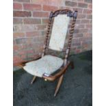 A 19TH CENTURY CARVED BARLEYTWIST FOLDING CHAIR, with modern and floral upholstered detail