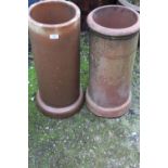 TWO CIRCULAR TERRACOTTA CHIMNEY POTS