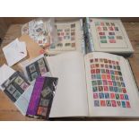 A STAMP COLLECTION LOOSE AND IN TWO ALBUMS