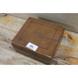 A LEATHER BOUND BOX CONTAINING A SMALL QUANTITY OF COINAGE ETC