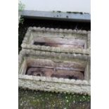 A PAIR OF RECTANGULAR CONCRETE GARDEN TROUGHS