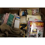A VINTAGE RUCK SACK AND A LARGE BOX OF MAGAZINES ETC