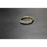 A HALLMARKED 18CT SEVEN STONE MARQUISE DIAMOND RING SET WITH AND ESTIMATED 1/3 OF A CARAT OF