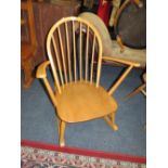 AN ERCOL BLONDE ROCKING CHAIR