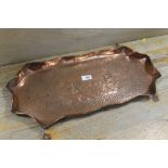 A WIDE COPPER TRAY, with decorative central vignette of a old copper mine and engine houses, hand