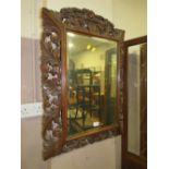 A 19TH CENTURY OAK AND PIERCED WALL MIRROR 94 X 64 CM