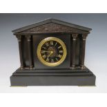 A BLACK SLATE GONG STRIKE MANTLE CLOCK, of architectural form with reeded columns and a black