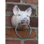 ***A PIG HEAD WITH METAL RING**