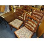 A SLIM OAK DROPLEAF TABLE AND FOUR CHAIRS