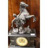 A SLATE MANTLE CLOCK WITH MARLEY HORSE SURMOUNT
