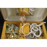 A COLLECTION OF COSTUME JEWELLERY TO INCLUDE CHAINS AND BROOCHES IN A VINTAGE MUSICAL BOX