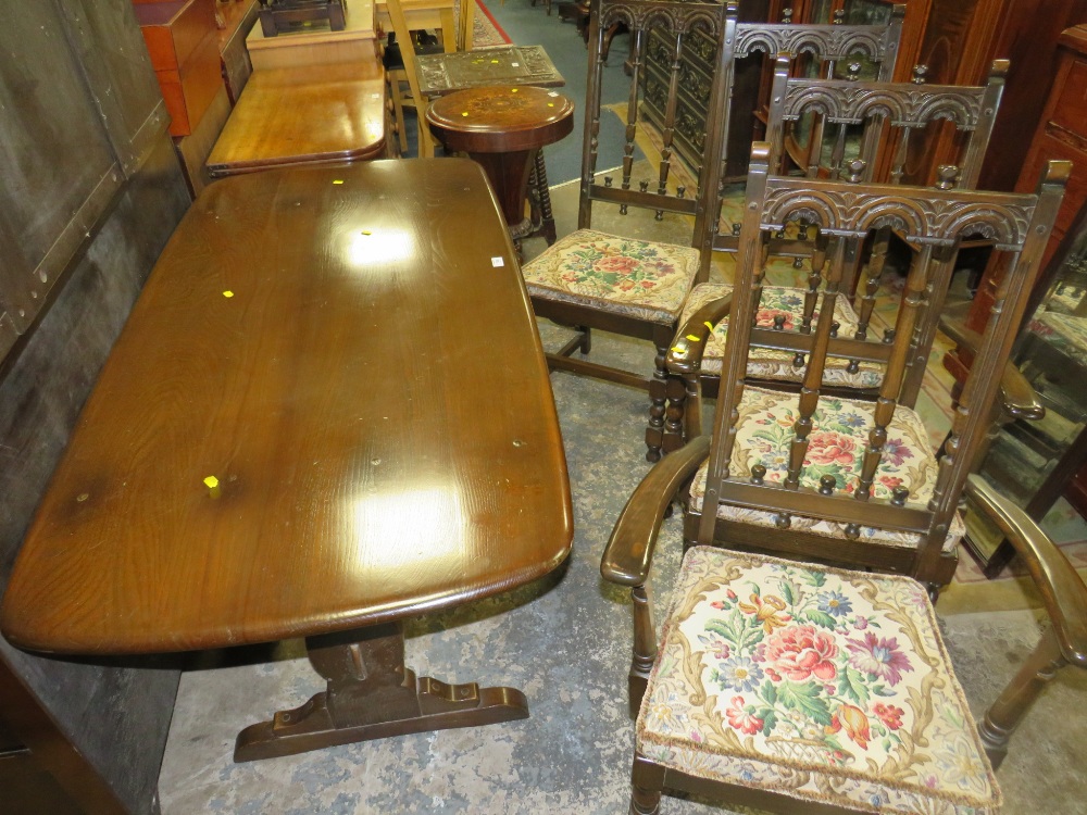 A DARK OAK ERCOL STYLE REFECTORY TABLE AND FOUR CHAIRS