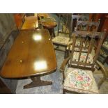 A DARK OAK ERCOL STYLE REFECTORY TABLE AND FOUR CHAIRS