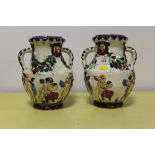 A PAIR OF CONTINENTAL STYLE TWIN HANDLED VASES