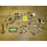 A TIN OF COLLECTABLES TO INC ENAMEL BADGES ETC