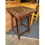 A LATE 19TH CENTURY CARVED OAK OCCASIONAL TABLE