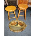 TWO MODERN CIRCULAR STOOLS AND A GILT MIRROR (3)