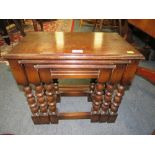 A SOLID OAK NEST OF THREE TABLES PLUS BRASS FENDER (2)