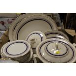 A TRAY OF ROYAL DOULTON CREAM BLUE AND GILT DINNERWARE