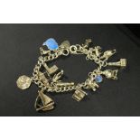 A SILVER CHARM BRACELET AND CHARMS - APPROX WEIGHT 46.38 G