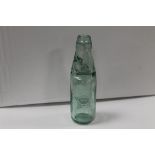 A VINTAGE GREEN GLASS DRINKS BOTTLE ADVERTISING HARDMAN AND OPENSHAW OF STAFFORD