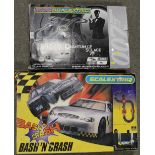 TWO BOXED SCALEXTRIC - QUANTUM OF SOLACE AND 'BASH N CRASH' - CONTENTS UNCHECKED
