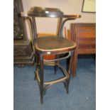 A TALL BENTWOOD BAR STOOL