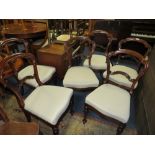 A SET OF SIX 19TH CENTURY ROSEWOOD CROWN BACK DINING CHAIRS, raised on shaped turned supports