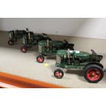 FOUR TIN PLATE TRACTORS